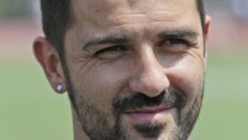 David Villa talks to reporters in front of Yankee Stadium in New York, Thursday, July 31, 2014. Villa, the Spanish all-time leading goal scorer, signed with the New York City Football Club, which will be playing in the stadium. (AP Photo/Seth Wenig)