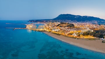 Denia aerial skyline at sunset in Mediterranean Alicante of Spain Drone point of view Costa Blanca with Montgo mountain background