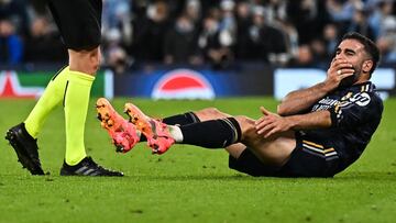 Real Madrid's Spanish defender #02 Dani Carvajal reacts following a foul from Manchester City's Belgian midfielder #11 Jeremy Doku during the UEFA Champions League quarter-final second-leg football match between Manchester City and Real Madrid, at the Etihad Stadium, in Manchester, north-west England, on April 17, 2024. (Photo by Paul ELLIS / AFP)