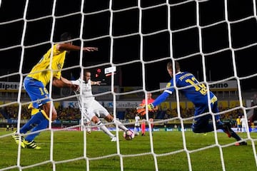 Benzema (centre) restores Madrid's lead from close range.