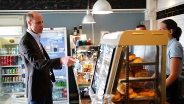 ISLES OF SCILLY, ENGLAND - MAY 10: Prince William, Prince of Wales, known as the Duke of Cornwall when in Cornwall, points to some food as he speaks to people in a store while visiting St. Mary's Harbour, the maritime gateway to the Isles of Scilly, to meet representatives from local businesses operating in the area on May 10, 2024 in Isles of Scilly, England. (Photo by Ben Birchall-WPA Pool/Getty Images)