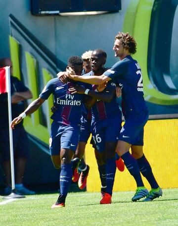 Paris St. Germain's Serge Aurier (L) is mobbed by teammates after scoring a goal during their International Champions Cup