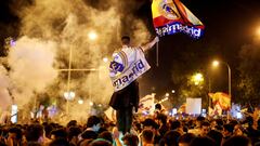 Real Madrid fans celebrate near the Cibeles fountain in central Madrid
