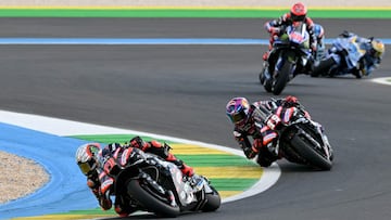 Aprilia Racing's Italian rider Marco Bezzecchi (L) and Aprilia Racing's Spanish rider Jorge Martin compete during the MotoGP sprint of the Grand Prix of Brazil at the Ayrton Senna International racetrack in Goiania, state of Goias, Brazil, on March 21, 2026. (Photo by EVARISTO SA / AFP)