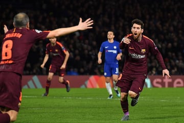 Lionel Messi celebrates with Andres Iniesta after scoring their first goal.