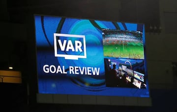 The big screen displays a message as a goal is reviewed by VAR