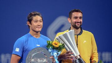 Croatia's Marin Cilic celebrates after winning the match against China's Zhang Zhizhen (L) in the men's singles final match at the ATP Hangzhou Open tennis tournament in Hangzhou, in eastern China's Zhejiang province on September 24, 2024. (Photo by AFP) / China OUT