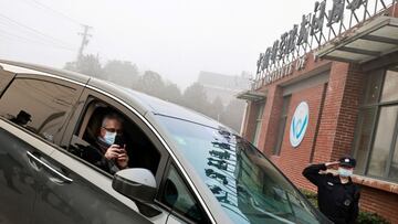 FILE PHOTO: Dominic Dwyer, a member of the World Health Organization (WHO) team tasked with investigating the origins of the coronavirus disease (COVID-19), sits in a car arriving to Wuhan Institute of Virology in Wuhan, Hubei province, China February 3, 2021. REUTERS/Thomas Peter/File Photo