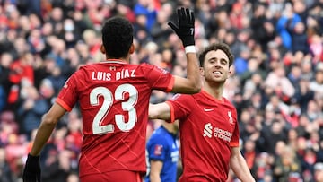 Liverpool's Portuguese striker Diogo Jota (R and, Liverpool's Colombian midfielder Luis Diaz (L) celebrate after Liverpool score their second goal during the English FA Cup fourth round football match between Liverpool and Cardiff City at Anfield in Liverpool, north west England on February 6, 2022. (Photo by Paul ELLIS / AFP) / RESTRICTED TO EDITORIAL USE. No use with unauthorized audio, video, data, fixture lists, club/league logos or 'live' services. Online in-match use limited to 120 images. An additional 40 images may be used in extra time. No video emulation. Social media in-match use limited to 120 images. An additional 40 images may be used in extra time. No use in betting publications, games or single club/league/player publications. /