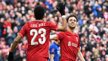 Liverpool's Portuguese striker Diogo Jota (R and, Liverpool's Colombian midfielder Luis Diaz (L) celebrate after Liverpool score their second goal during the English FA Cup fourth round football match between Liverpool and Cardiff City at Anfield in Liverpool, north west England on February 6, 2022. (Photo by Paul ELLIS / AFP) / RESTRICTED TO EDITORIAL USE. No use with unauthorized audio, video, data, fixture lists, club/league logos or 'live' services. Online in-match use limited to 120 images. An additional 40 images may be used in extra time. No video emulation. Social media in-match use limited to 120 images. An additional 40 images may be used in extra time. No use in betting publications, games or single club/league/player publications. / 