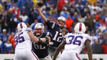 Oct 30, 2016; Orchard Park, NY, USA; New England Patriots quarterback Tom Brady (12) throws a pass under pressure by Buffalo Bills defensive end Kyle Williams (95) as offensive guard Joe Thuney (62) blocks during the second half at New Era Field. The Patriots beat the Bills 41-25. Mandatory Credit: Kevin Hoffman-USA TODAY Sports