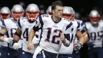 Jan 1, 2017; Miami Gardens, FL, USA;  New England Patriots quarterback Tom Brady (12) leads his team out of the tunnel before an NFL football game against the Miami Dolphins at Hard Rock Stadium. The Patriots won 35-14. Mandatory Credit: Reinhold Matay-USA TODAY Sports