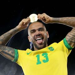 Is Barcelona's Dani Alves the most decorated men's player ever? How many trophies has he won?
