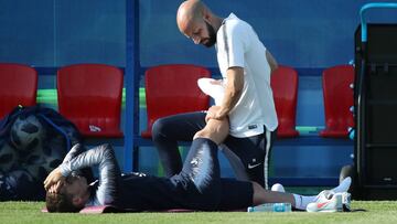 Griezmann con el preparador físico.
