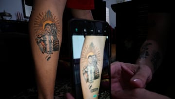 Franco Gundin, 22, displays a tattoo of Argentina's soccer star Lionel Messi, holding the Copa America trophy, in Buenos Aires, Argentina December 17, 2022. REUTERS/Magali Druscovich