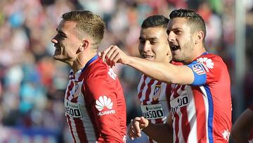 Koke, junto a Griezmann.