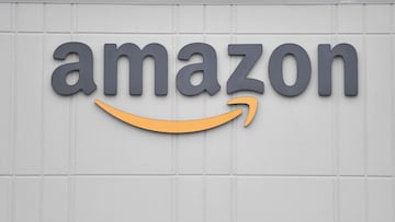 In this file photo taken on March 30, 2020, the logo of US online retail giant Amazon is seen at the distribution center in Staten Island as workers strike in demand that the facility be shut down and cleaned after one staffer tested positive for the coro