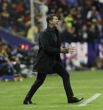 Atlético head coach Diego Simeone urges his players on from the touchline.