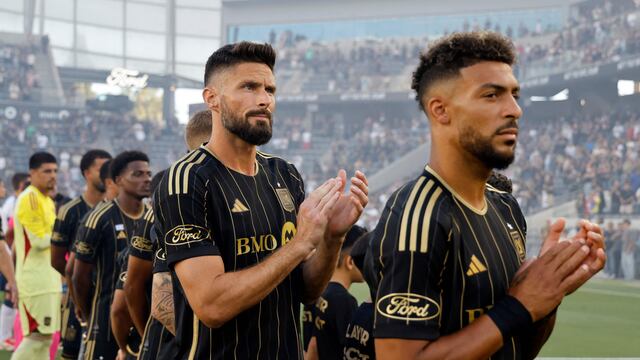 LOS ANGELES, CALIFORNIA - JUNE 29: Olivier Giroud #9 and Denis Bouanga #99 of Los Angeles FC after singing of Canadian and United States national anthems prior to an MLS soccer match against at BMO Stadium on June 29, 2025 in Los Angeles, California. Kevork Djansezian/Getty Images/AFP (Photo by KEVORK DJANSEZIAN / GETTY IMAGES NORTH AMERICA / Getty Images via AFP)