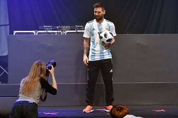 Barcelona and Argentina forward Lionel Messi poses with the official match ball for the 2018 World Cup football tournament, named "Telstar 18", during its unveiling ceremony in Moscow on November 9, 2017.