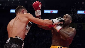 QUEBEC CITY, QC - DECEMBER 1: Oleksandr Gvosdyk (black trunk) punches Adonis Stevenson (gold trunk) during their WBC light heavyweight championship fight at the Videotron Center on December 1, 2018 in Quebec City, Quebec, Canada.   Mathieu Belanger/Getty 