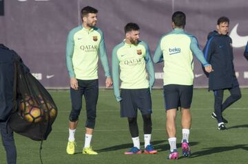 Gerard Pique and Lionel Messi during training with Barcelona.