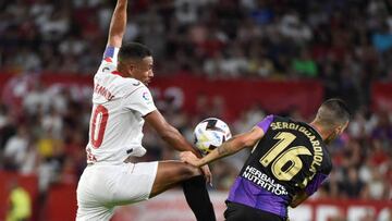 Sevilla's Brazilian midfielder Fernando Reges (L) jumps for the ball next to Real Valladolid's Spanish forward Sergi Guardiola during the Spanish League football match between Sevilla FC and Real Valladolid FC at the Ramon Sanchez Pizjuan stadium in Seville on August 19, 2022. (Photo by CRISTINA QUICLER / AFP) (Photo by CRISTINA QUICLER/AFP via Getty Images)