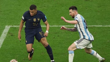 France's forward #10 Kylian Mbappe fights for the ball with Argentina's forward #10 Lionel Messi during the Qatar 2022 World Cup final football match between Argentina and France at Lusail Stadium in Lusail, north of Doha on December 18, 2022. (Photo by JACK GUEZ / AFP) (Photo by JACK GUEZ/AFP via Getty Images)