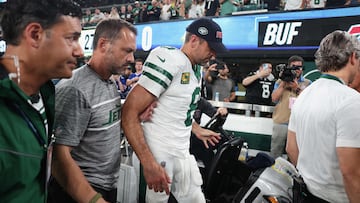 EAST RUTHERFORD, NEW JERSEY - SEPTEMBER 11: Quarterback Aaron Rodgers #8 of the New York Jets is helped off the field after an injury during the first quarter of the NFL game against the Buffalo Bills at MetLife Stadium on September 11, 2023 in East Rutherford, New Jersey.   Elsa/Getty Images/AFP (Photo by ELSA / GETTY IMAGES NORTH AMERICA / Getty Images via AFP)