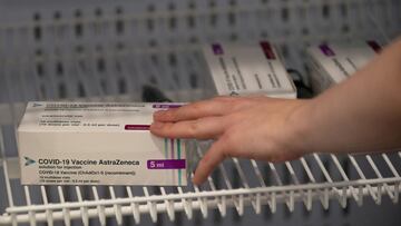 FILE PHOTO: Boxes of the Oxford/AstraZeneca COVID-19 vaccine are pictured in a refrigerator at a NHS mass coronavirus vaccination centre at Robertson House in Stevenage, Hertfordshire, Britain January 11, 2021. Joe Giddens/Pool via REUTERS//File Photo