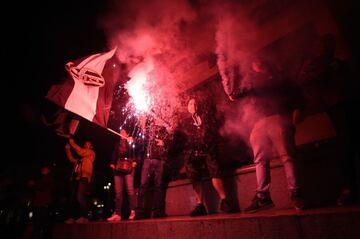 Juventus' supporters celebrate in central Turin after their team won a seventh straight Serie A title "scudetto" after a goalless draw against ten-man Roma at the Stadio Olimpico, on May 13, 2018. 
The Turin giants become the first team to complete the le
