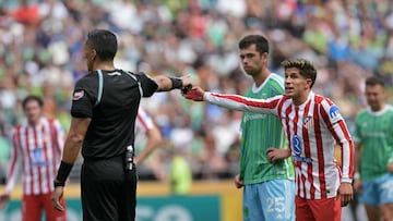 Atletico Madrid's Argentine forward #22 Giuliano Simeone (R) argues with Argentinian referee Yael Falcon Perez during the FIFA Club World Cup 2025 Group B football match between US Seattle Sounders and Spain's Atletico de Madrid at the Lumen Field stadium in Seattle on June 19, 2025. (Photo by JUAN MABROMATA / AFP)