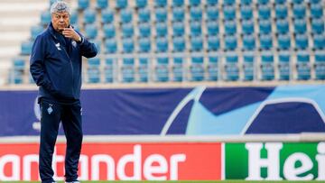 Kyiv's Romanian head coach Mircea Lucescu stands on the pitch during a training session in Gent on September 22, 2020 on the eve of their UEFA Champions League qualifier football match KAA Gent vs Dynamo Kyiv. (Photo by JASPER JACOBS / BELGA / AFP) /