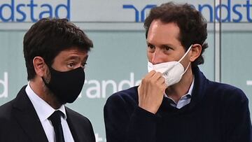 Juventus FC President Andrea Agnelli (L) and Fiat Chrysler Automobiles (FCA) Chairman John Elkann attend the Italian Serie A football match Juventus vs AC Milan on May 09, 2021 at the Juventus stadium in Turin. (Photo by Marco BERTORELLO / AFP)