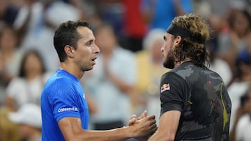Aug 29, 2022; Flushing, NY, USA; Daniel Elahi Galan of Colombia, left, and Stefanos Tsitsipas of Greece shake hands after their first round match on day one of the 2022 U.S. Open tennis tournament at USTA Billie Jean King National Tennis Center. Mandatory Credit: Jerry Lai-USA TODAY Sports