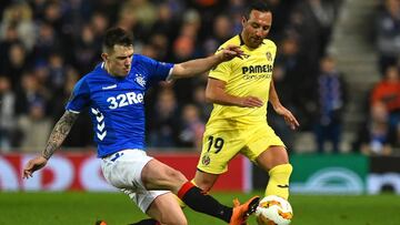 Rangers' Scottish midfielder Ryan Jack (L) tackles Villarreal's Spanish midfielder Santi Cazorla (R) during the UEFA Europa League Group G football match between Rangers and Villarreal at Ibrox Stadium in Glasgow, Scotland on November 29, 2018.