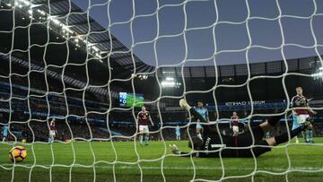 Burnley&#039;s English goalkeeper Tom Heaton dives but fails to save a shot from Manchester City&#039;s French defender Gael Clichy