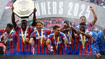 Soccer Football - FA Community Shield - Crystal Palace v Liverpool - Wembley Stadium, London, Britain - August 10, 2025 Crystal Palace's Marc Guehi lifts the trophy as he celebrates with teammates after winning the FA Community Shield REUTERS/Matthew Childs
