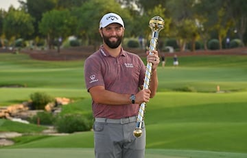 Jon Rahm of Spain poses with the Race to Dubai at Jumeirah Golf Estates in Dubai on November 20, 2022. 