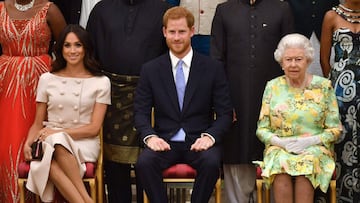 The late Queen with Harry and Meghan.