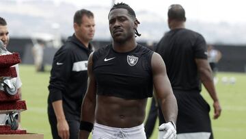 FILE - In this Aug. 20, 2019, file photo, Oakland Raiders&#039; Antonio Brown walks off the field after NFL football practice in Alameda, Calif. Star receiver Antonio Brown is not with the Oakland Raiders four days before the season opener amid reports he could be suspended over a confrontation with general manager Mike Mayock.
 Mayock issued a brief statement at the beginning of practice Thursday, Sept. 5, 2019, saying that Brown wasn&#039;t at the Raiders facility and won&#039;t be practicing a day after Brown posted a letter from the GM on social media detailing nearly $54,000 in fines. (AP Photo/Jeff Chiu, File)