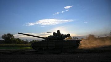 Ukrainian soldiers ride a tank in eastern Ukraine, on September 22, 2022, amid the Russian invasion of Ukraine. (Photo by Juan BARRETO / AFP) (Photo by JUAN BARRETO/AFP via Getty Images)