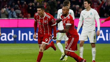 Soccer Football - Bundesliga - Bayern Munich vs Werder Bremen - Allianz Arena, Munich, Germany - January 21, 2018 Bayern Munich's Robert Lewandowski celebrates scoring their second goal with Arturo Vidal REUTERS/Michaela Rehle DFL RULES TO LI
