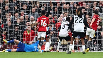 Manchester United's English defender #05 Harry Maguire (R) scores the equalising goal during the English Premier League football match between Manchester United and Fulham at Old Trafford in Manchester, north west England, on February 24, 2024. (Photo by Darren Staples / AFP) / RESTRICTED TO EDITORIAL USE. No use with unauthorized audio, video, data, fixture lists, club/league logos or 'live' services. Online in-match use limited to 120 images. An additional 40 images may be used in extra time. No video emulation. Social media in-match use limited to 120 images. An additional 40 images may be used in extra time. No use in betting publications, games or single club/league/player publications. / 