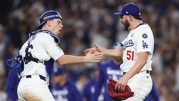 LOS ANGELES, CALIFORNIA - OCTOBER 26: Will Smith #16 and Alex Vesia #51 of the Los Angeles Dodgers celebrate their 4-2 win over the New York Yankees during Game Two of the 2024 World Series at Dodger Stadium on October 26, 2024 in Los Angeles, California. Harry How/Getty Images/AFP (Photo by Harry How / GETTY IMAGES NORTH AMERICA / Getty Images via AFP)