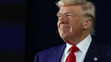 U.S. President Donald Trump looks on during a rally to mark his 100th day in office, at Macomb Community College in Warren, Michigan, U.S., April 29, 2025. REUTERS/Evelyn Hockstein