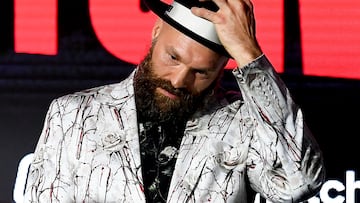 (FILES) Britain's Tyson Fury arrives for a press conference ahead of his undisputed heavyweight world championship rematch with Ukraine's Oleksandr Usyk, in Riyadh on December 19, 2024. Former world heavyweight champion Tyson Fury said Monday, January 13, he had retired from boxing. "I'm going to make this short and sweet," said British fighter Fury in a social media post. "I'd like to announce my retirement from boxing. It's been a blast, I've loved every single minute of it." (Photo by AFP)