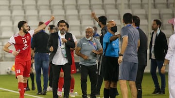 Persepolis&#039; forward Mehdi Abdi (L) celebrates after scoring during the AFC Champions League semi-finals match between Saudi&#039;s Al-Nassr and Iran&#039;s Persepolis on October 3, 2020, at the Jassim Bin Hamad Stadium in the Qatari capital Doha. (Ph