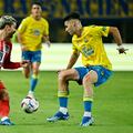 Atletico Madrid's French forward #07 Antoine Griezmann (L) vies with Las Palmas' Spanish defender #15 Mika Marmol during the Spanish league football match between UD Las Palmas and Club Atletico de Madrid at the Gran Canaria stadium in Las Palmas de Gran Canaria on November 3, 2023. (Photo by JAVIER SORIANO / AFP)