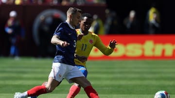 France's defender #03 Lucas Digne and Colombia's midfielder #11 Jhon Arias fight for the ball during a friendly football match between Colombia and France at Northwest Stadium in Landover, Maryland, on March 29, 2026. (Photo by FRANCK FIFE / AFP)